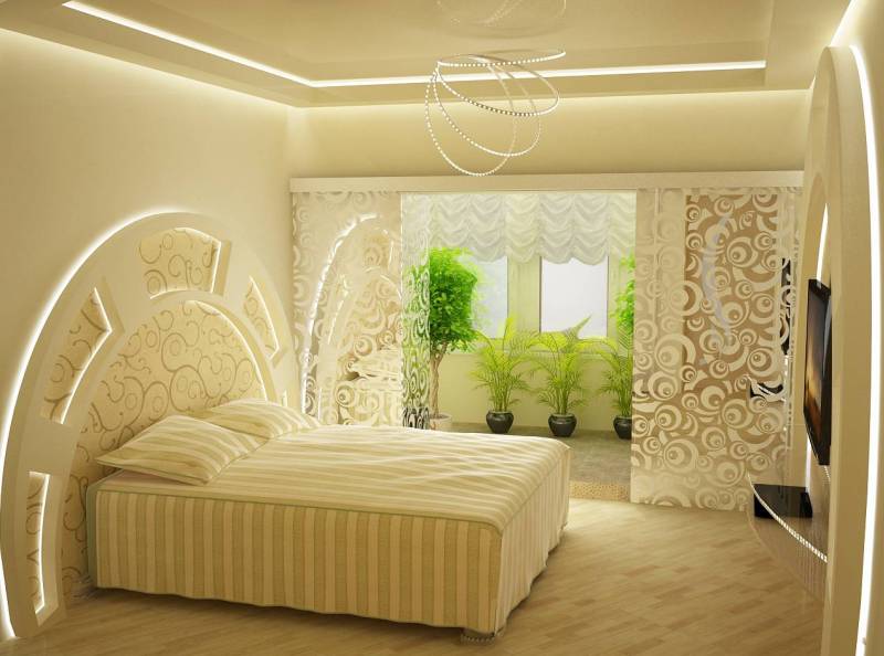 Светлый ванильный дизайн спальни украшен зелеными растениями